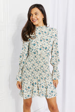 Load image into Gallery viewer, Meadowscape Floral Smocked Mock Neck Mini Dress
